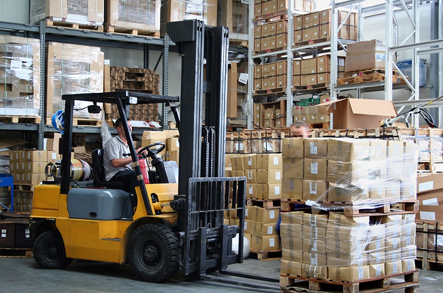 Forklifts vs. Overhead Cranes: Forklift in a Warehouse