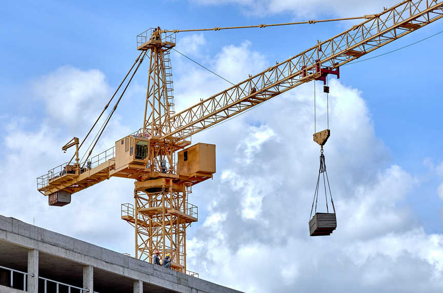 Hammerhead Tower Crane with Load During Construction of Building