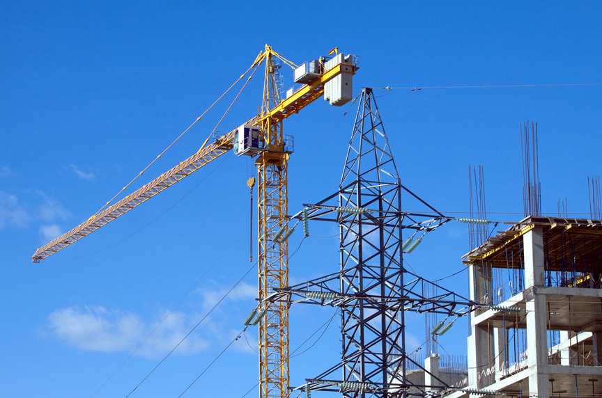 Tower Crane with Power Lines at Construction Site