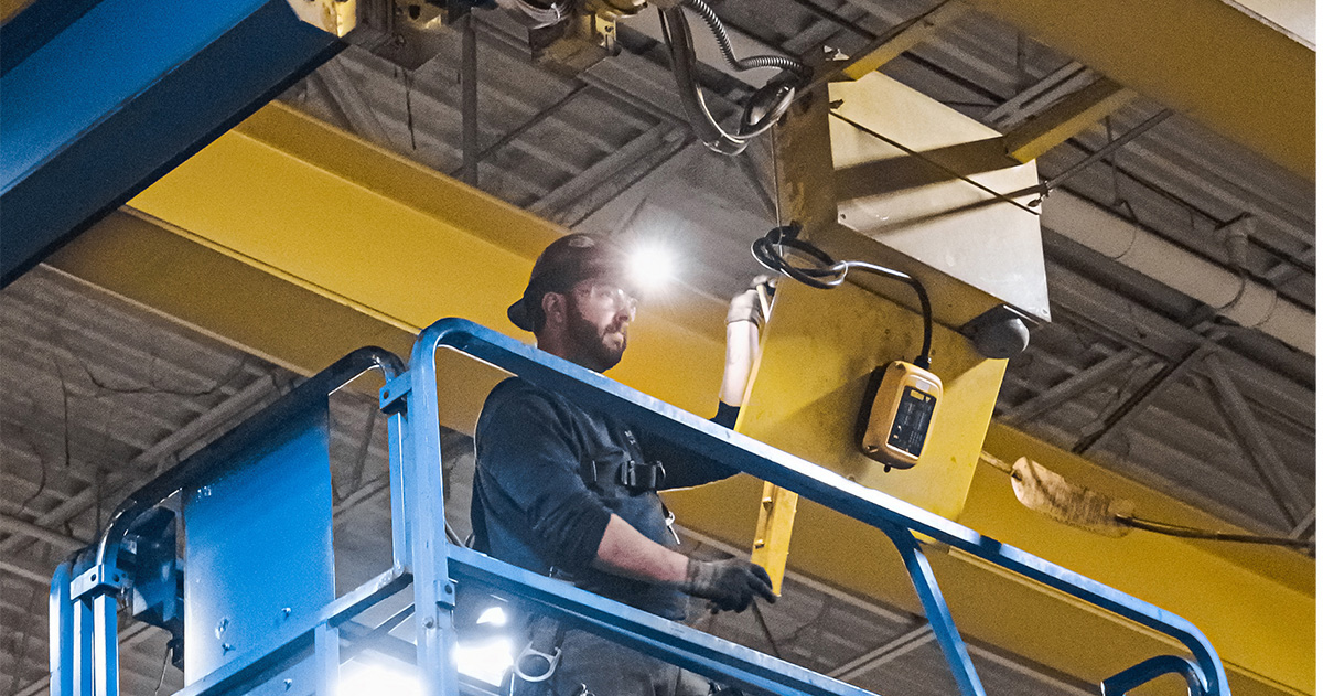 Overhead Crane Service Technician Performing Inspection